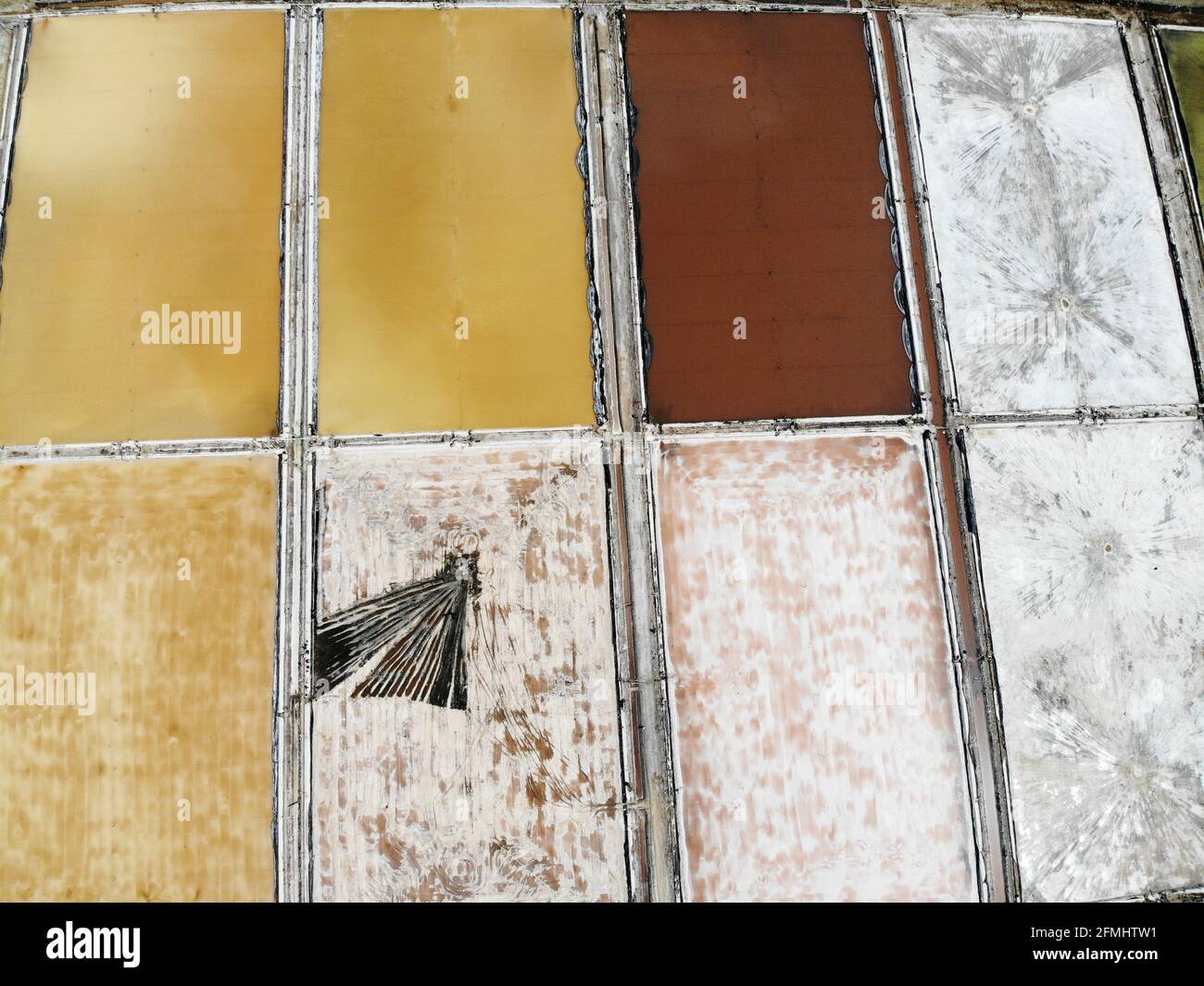 Lianyungang, China. 09th May, 2021. The workers are doing the salt tedding job in Lianyungang, Jiangsu, China on 09th May, 2021.(Photo by TPG/cnsphotos) Credit: TopPhoto/Alamy Live News Stock Photo