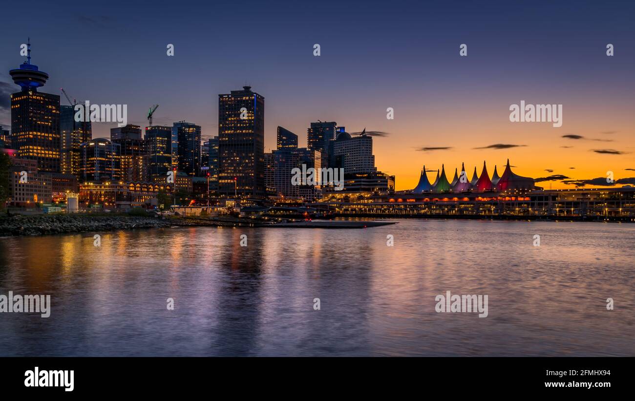 Sunset over the Harbor and the Sails of Canada Place, the Cruise Ship Terminal and Convention Center on the Waterfront of Vancouver, British Columbia, Stock Photo