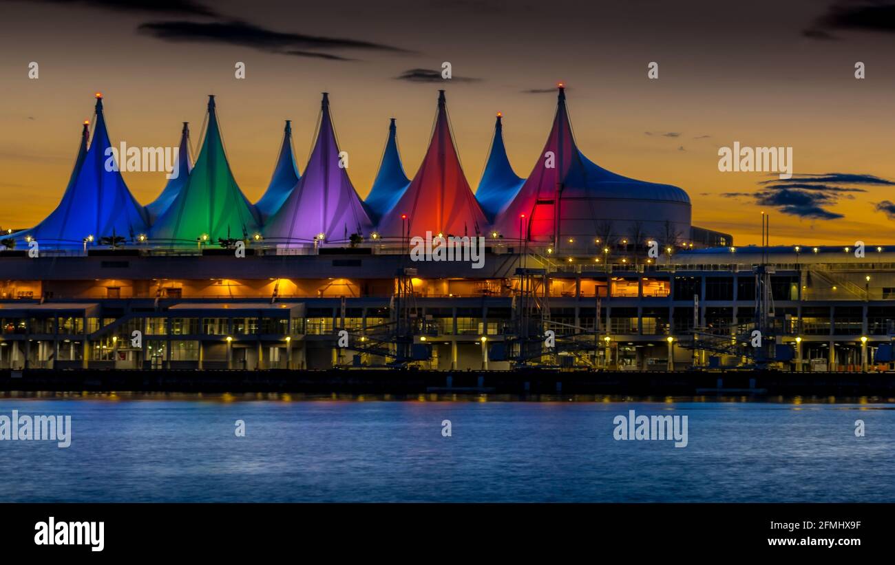 Blue Hour after Sunset over the Harbor and Colorful Sails of Canada Place, the Cruise Ship Terminal on the Waterfront of Vancouver, Canada Stock Photo