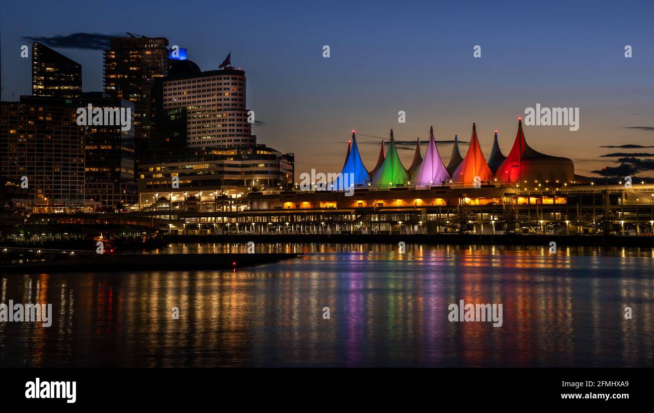 Blue Hour after Sunset over the Harbor and Colorful Sails of Canada Place, the Cruise Ship Terminal on the Waterfront of Vancouver, Canada Stock Photo