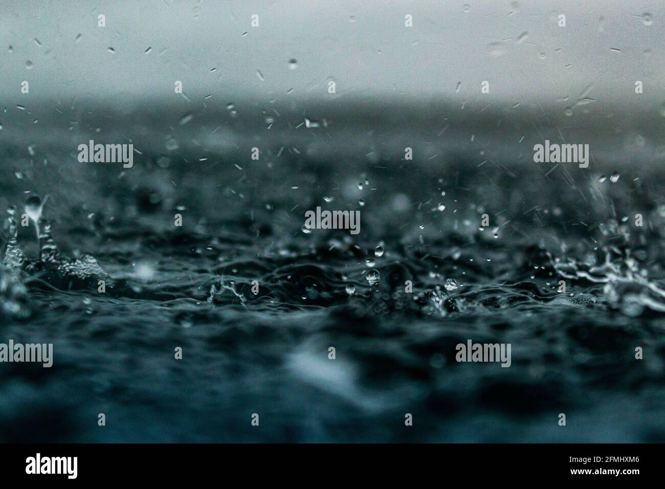Rain on ocean surface hires stock photography and images Alamy