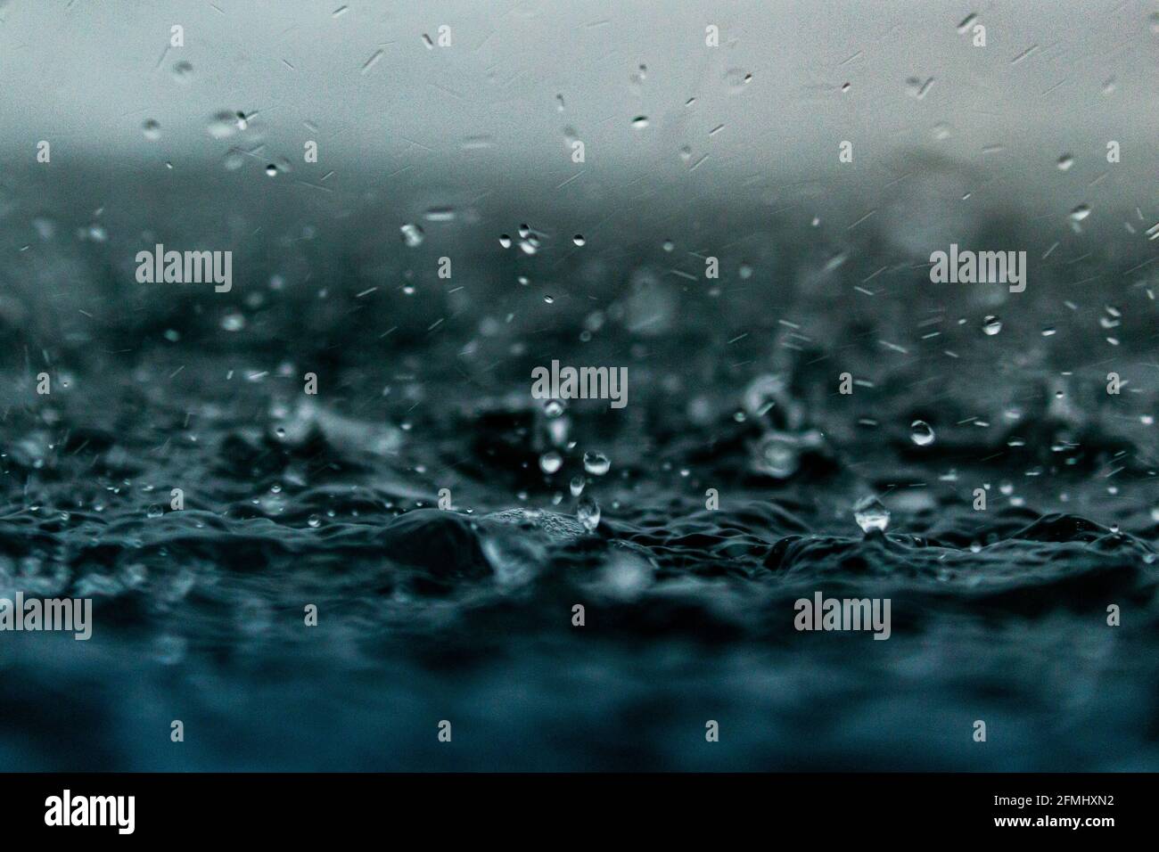 Droplets Hitting The Water Surface Ocean Sea Rain Drops Stock Photo