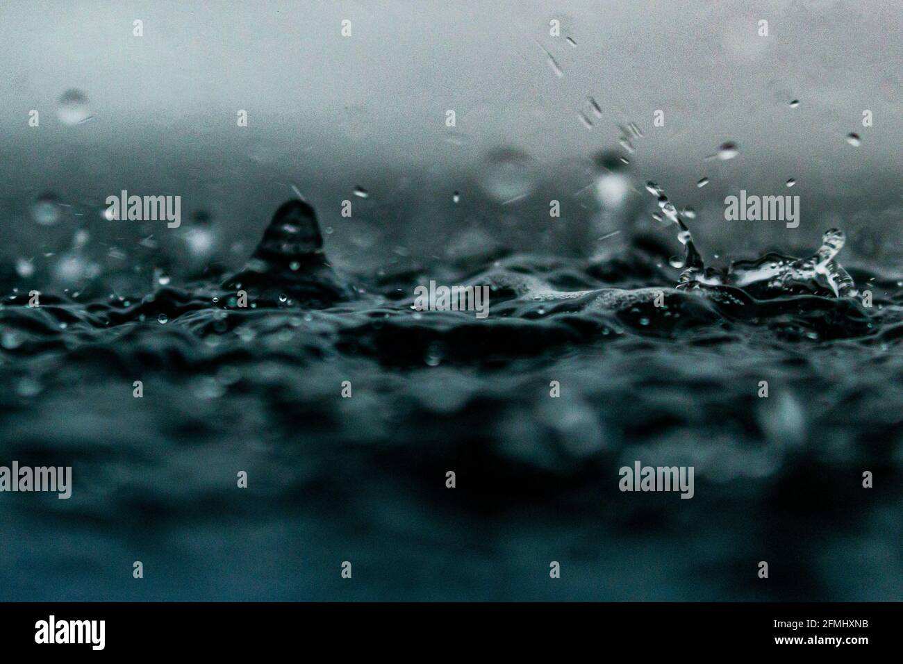 Droplets Hitting The Water Surface Ocean Sea Rain Drops Stock Photo