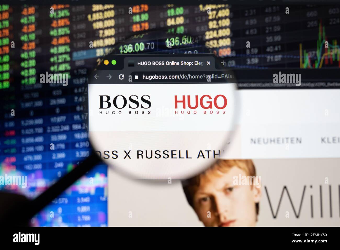 Hugo Boss company logo on a website with blurry stock market developments  in the background, seen on a computer screen through a magnifying glass  Stock Photo - Alamy