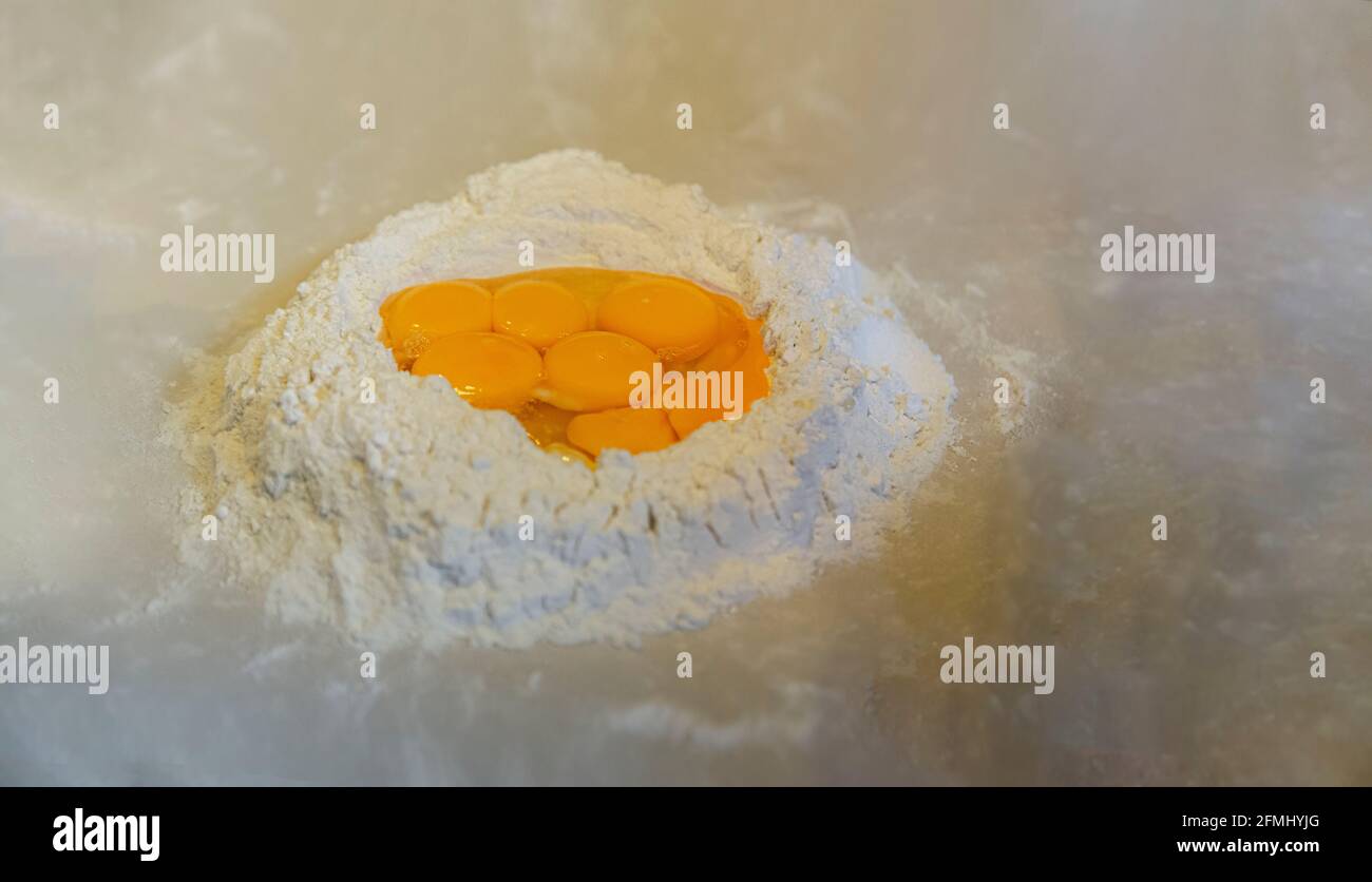 Flour and eggs on the marble floor Stock Photo