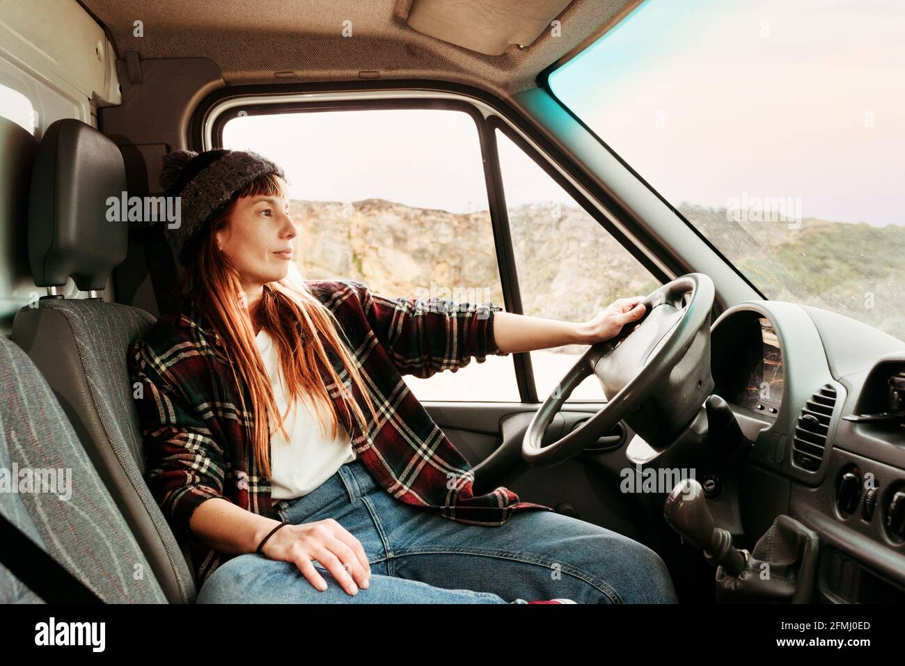 Back view of crop unrecognizable female explorer navigating with ...