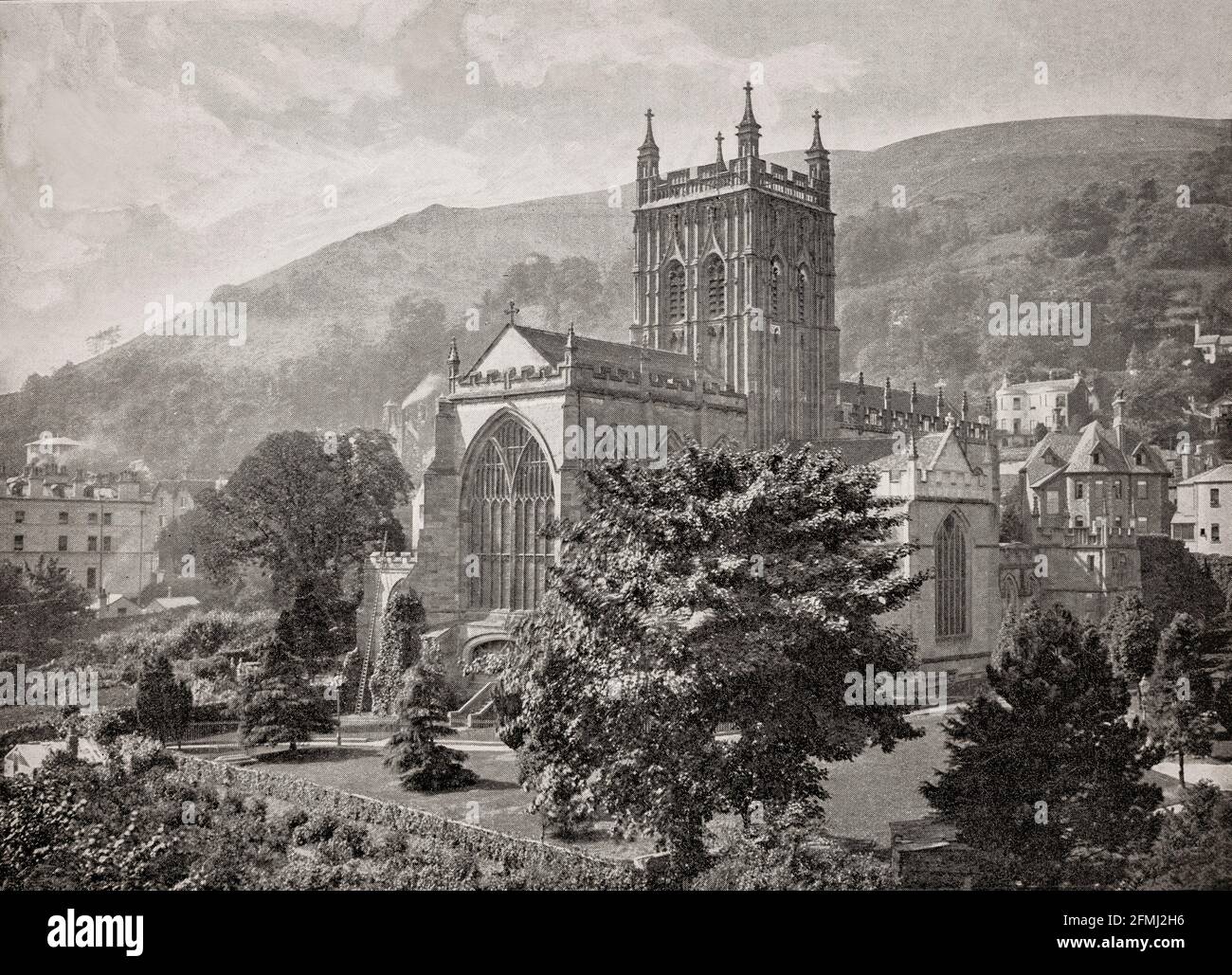 A late 19th Century view of Great Malvern Priory in Malvern, Worcestershire, England, formerly a Benedictine monastery it's now an Anglican parish church. The present building dates from 1085, with mainly 15th-century structure, floor, and wall tiles. Extensions to the original Norman architecture church began around 1440 in the Perpendicular style and work continued until 1502. In 1860 major restoration work was carried out by Sir George Gilbert Scott. Stock Photo