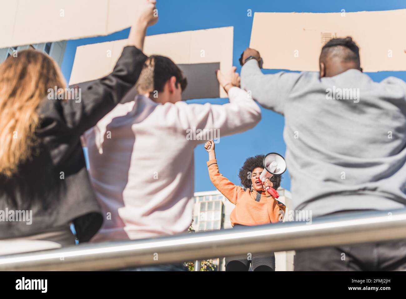 African American female social justice warrior with speaker against ...