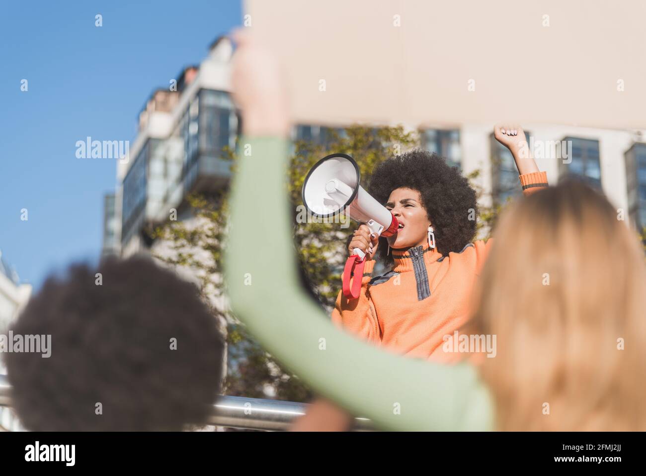 African American female social justice warrior with speaker against ...