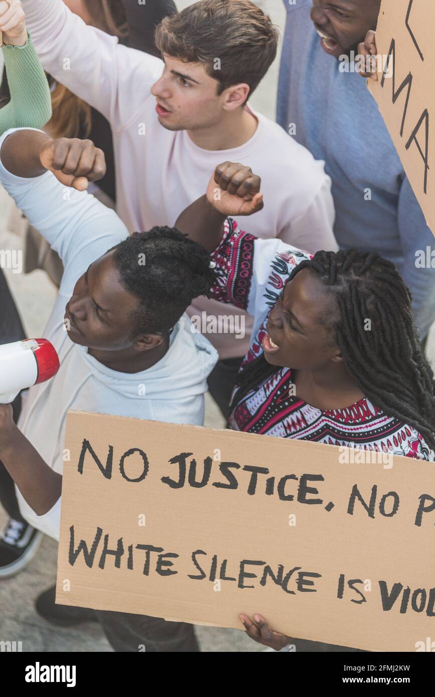 From above of crowd of multiracial people with posters screaming during Black Lives Matter demonstration in city Stock Photo