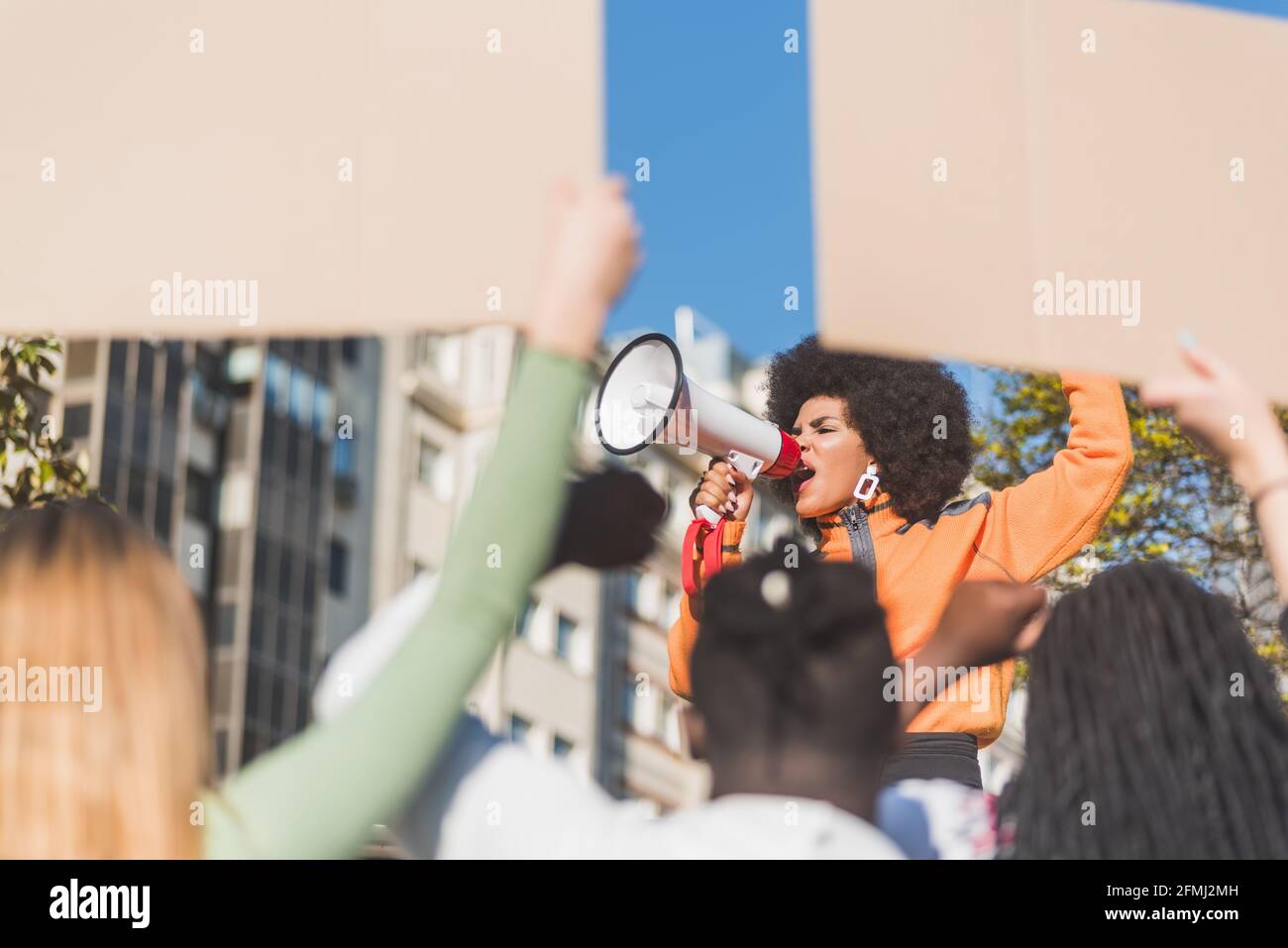 African American female social justice warrior with speaker against ...