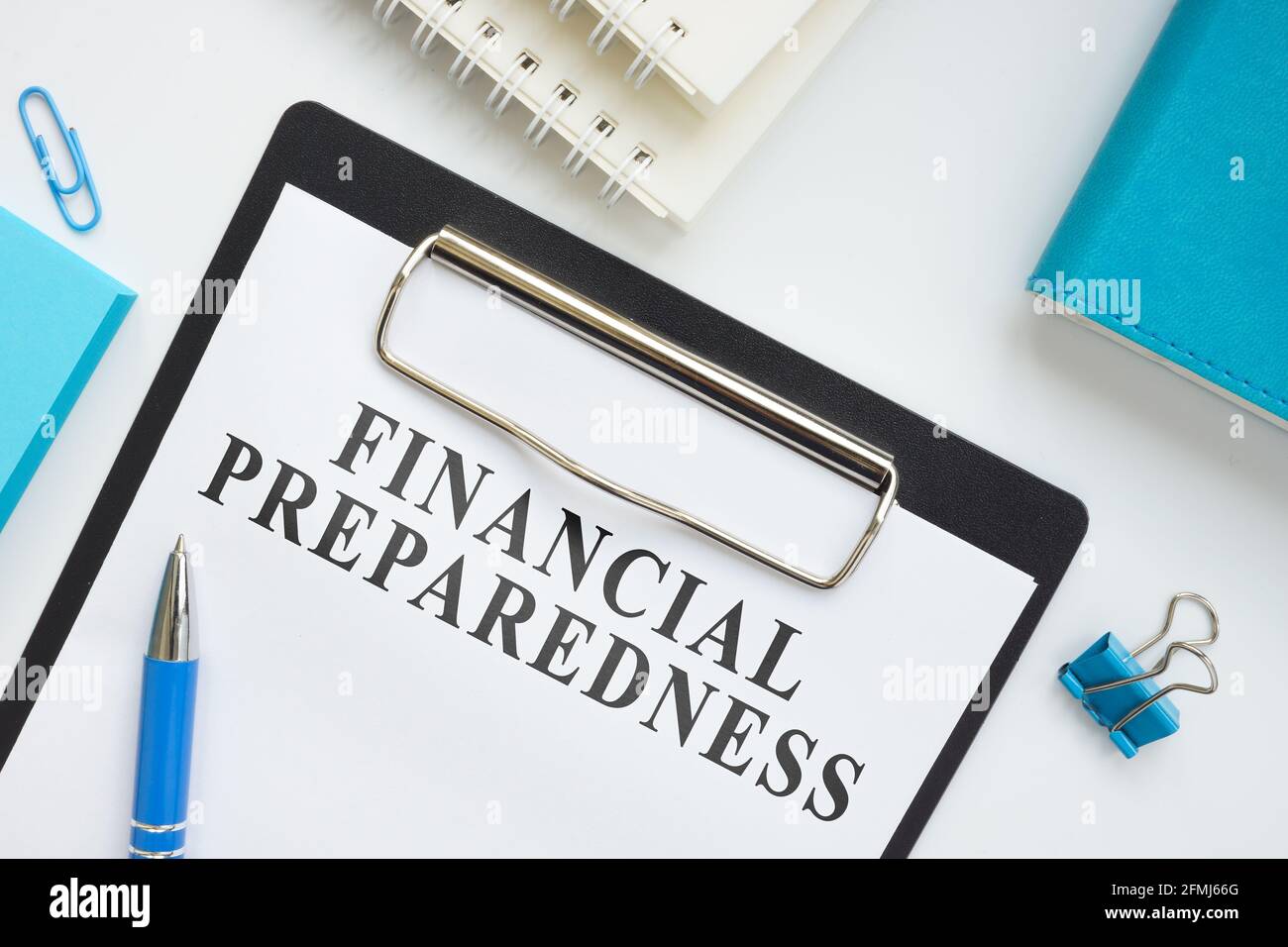Financial Preparedness plan and office supplies on the surface. Stock Photo