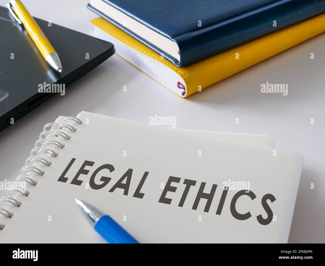 Documents about legal ethics and laws on the desk. Stock Photo