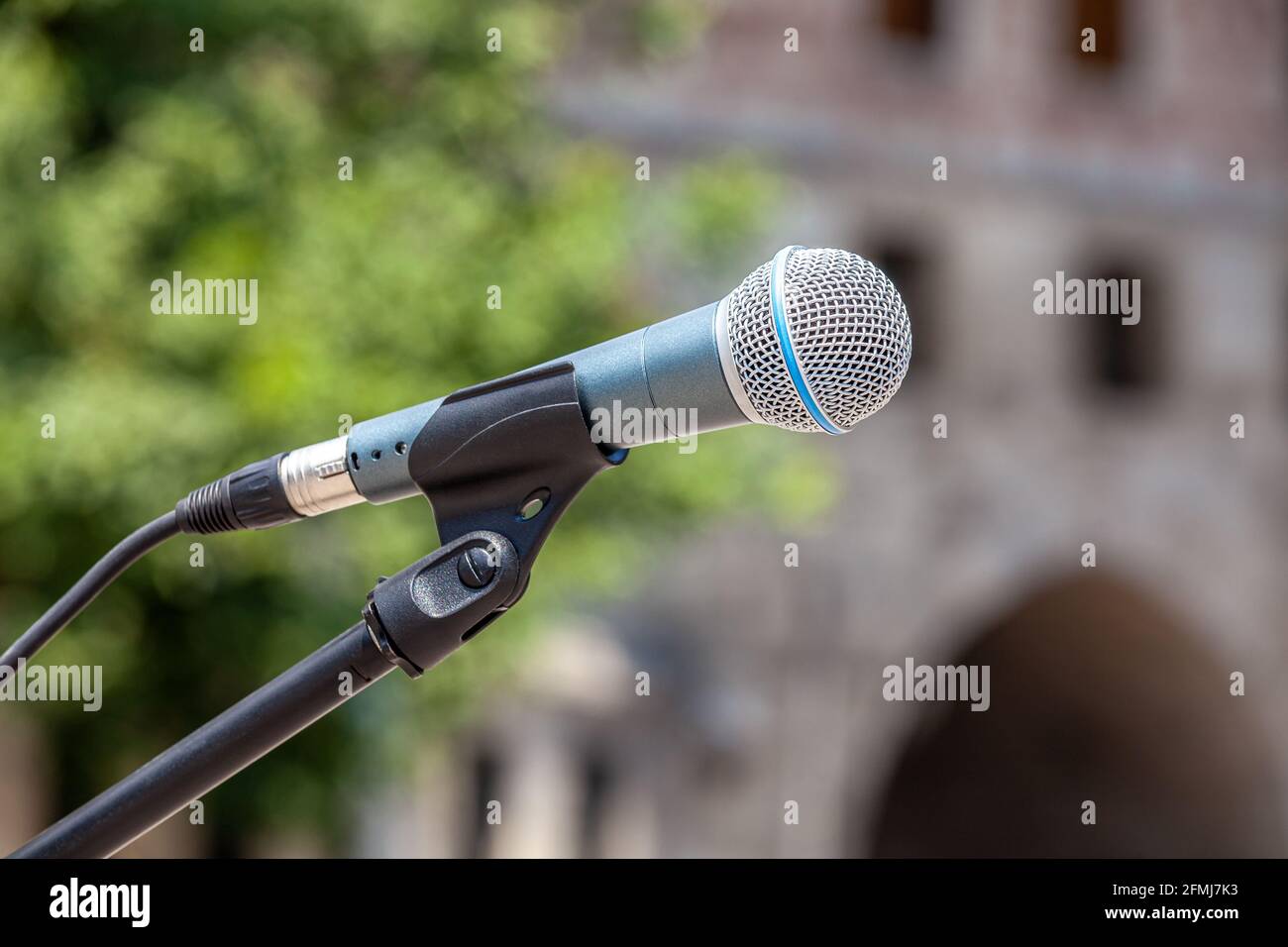 Microphone on abstract blurred meeting area Stock Photo