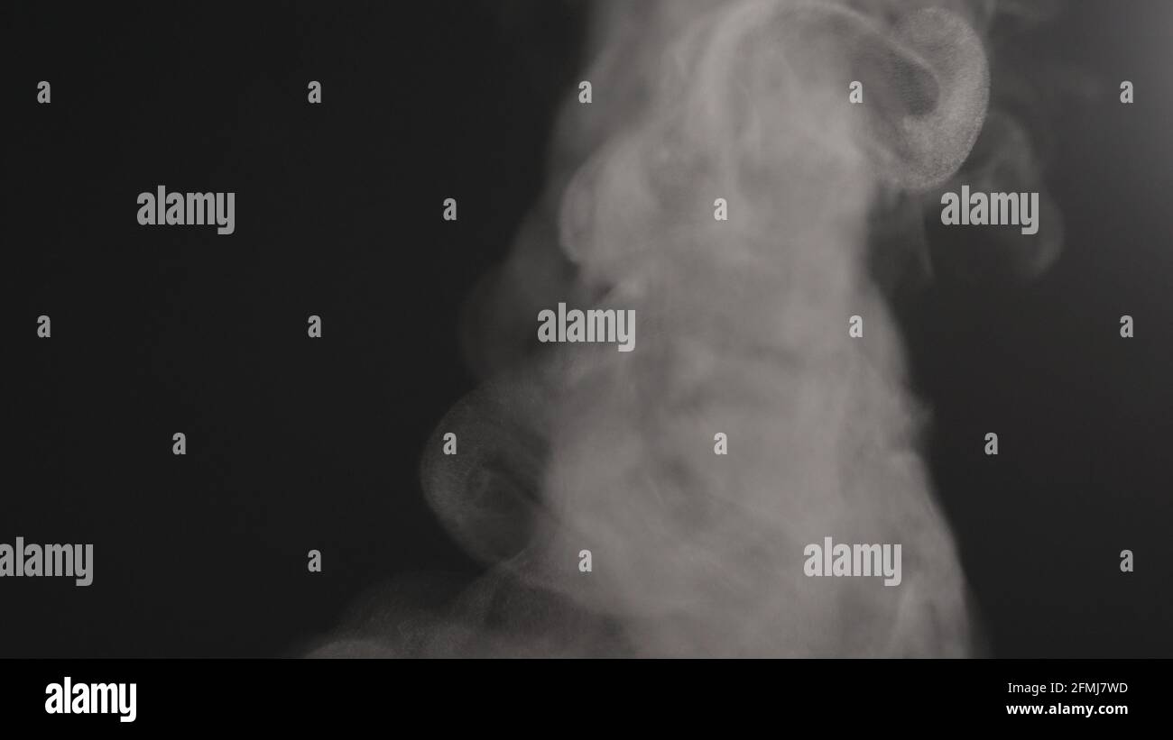 hot water steam rising over black background, wide photo Stock Photo ...