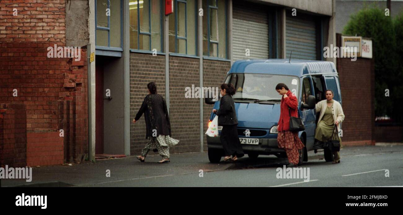 Bugsy Babywear clothing factory   Oct 1999     Workers arriving at the Bugsy Babywear clothing factory in West Bromwich, just before 8 a.m. this morning. Note, the van they have arrived in has no windows in the back. Stock Photo