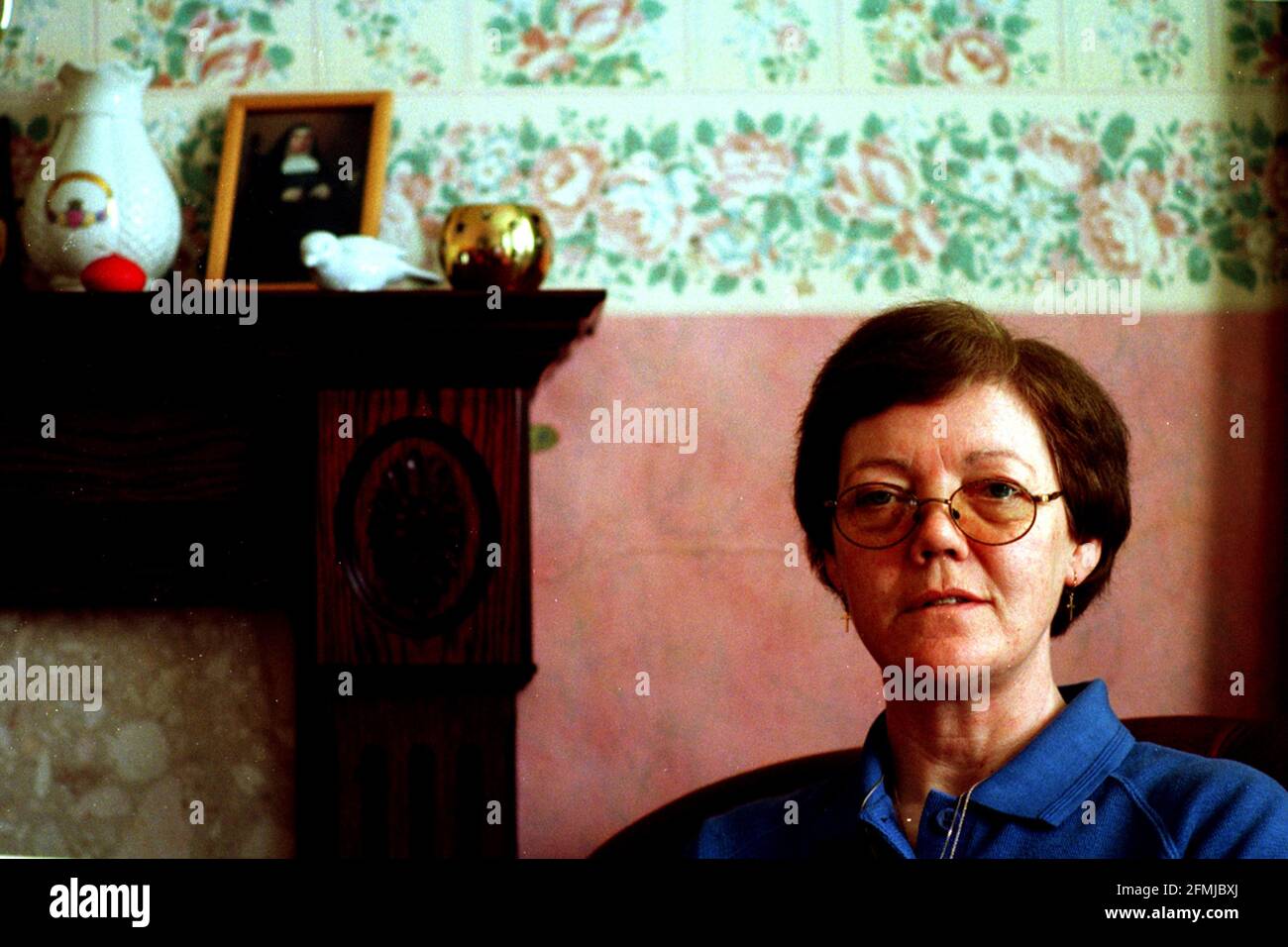 Josephine Cregan March 1999 who is being made redundant by the nuns at St  Michael's Convent in Streatham. She is photographed in her home, the lodge of the convent Stock Photo