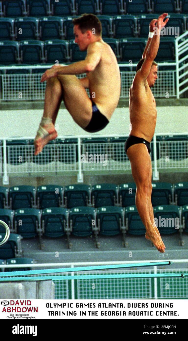 DIVERS GO THROUGH THEIR FLIGHT MANOEUVRES IN OLYMPIC PRACTICE AT THE GEORGIA AQUATIC CENTRE Stock Photo
