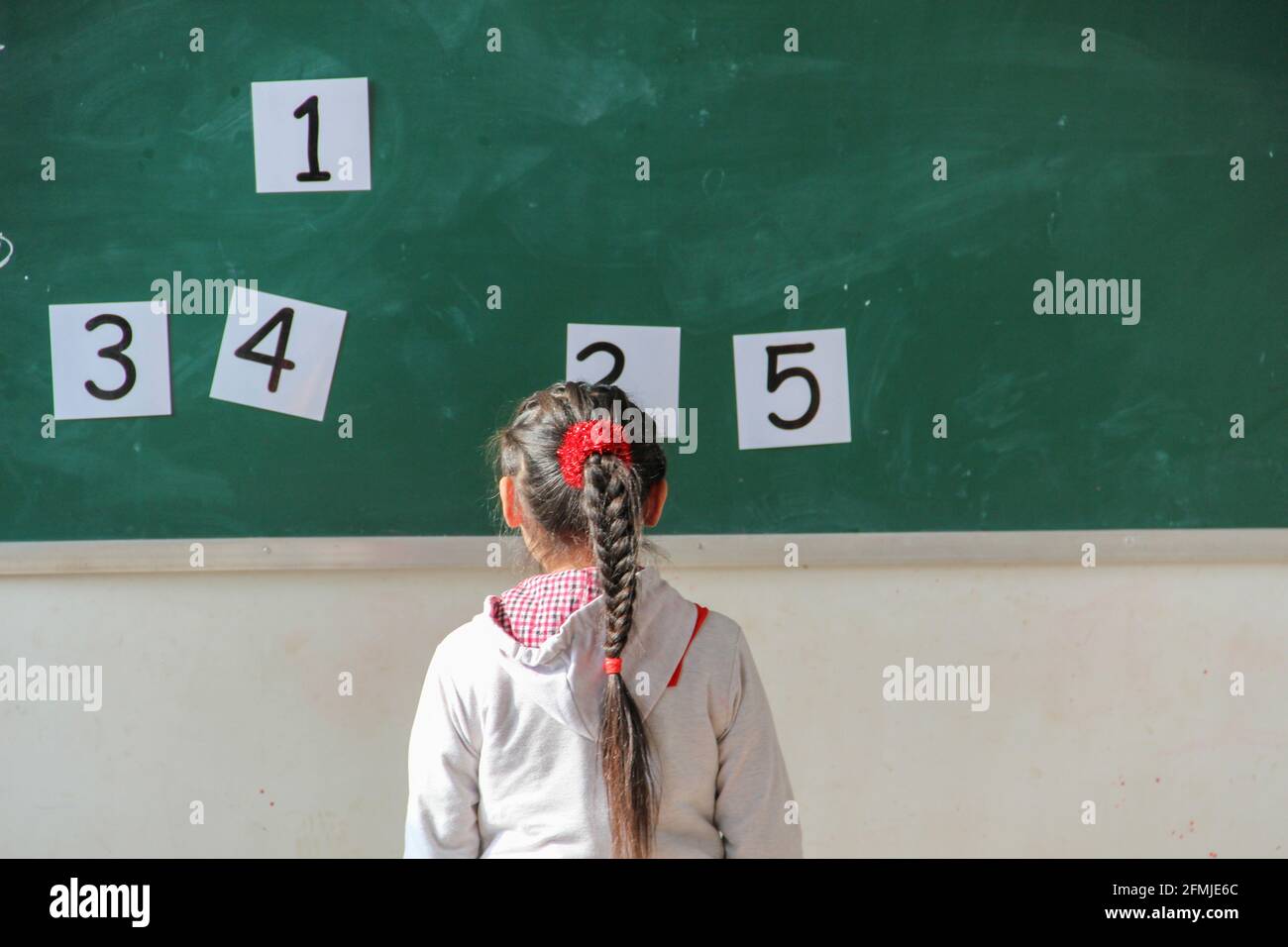 This rural school was destroyed during the 2008 Sichuan earthquake. Sutdent learning English and must choose the correct number. Stock Photo