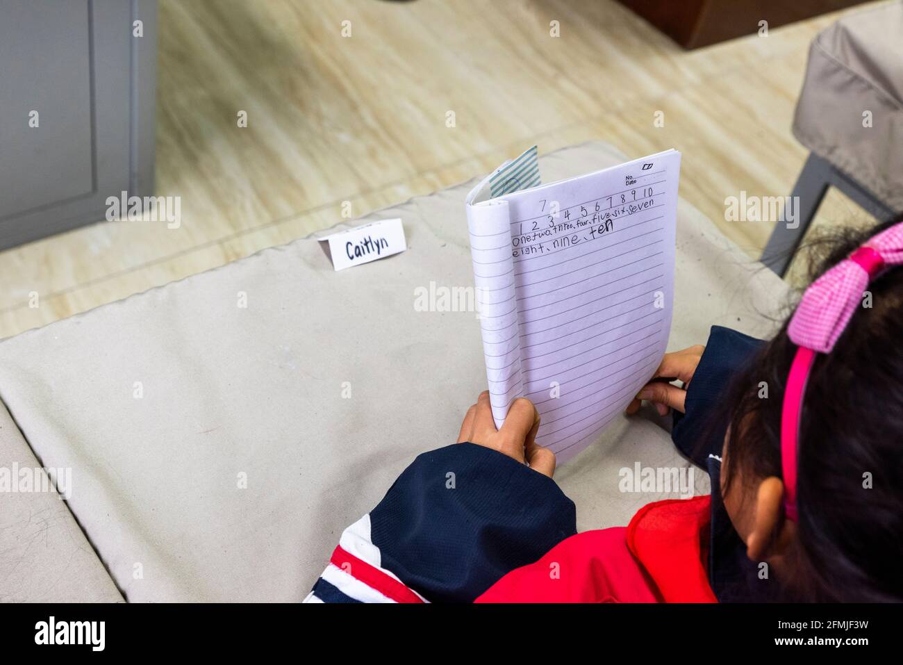 Primary student learning numbers in English at BoAi school in rural Shanxi, China. Stock Photo