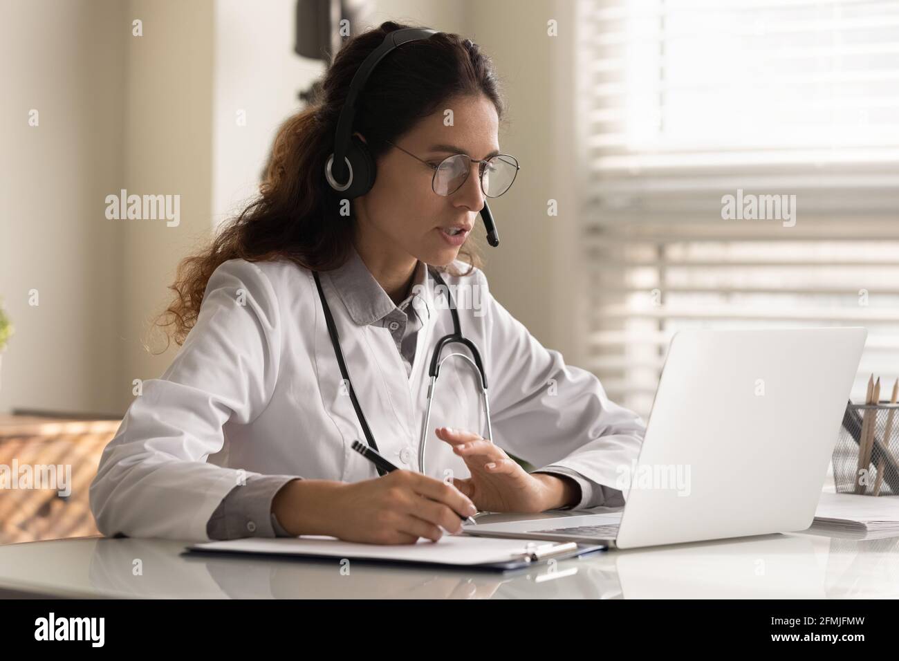 Doctor taking notes telehealth hi-res stock photography and images - Alamy
