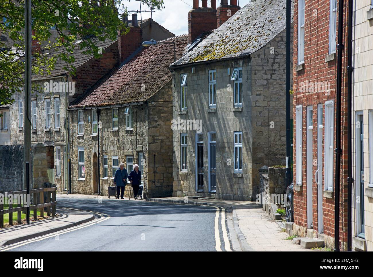 Terrace of houses built from the local limestone, Tadcaster, North Yorkshire, England UK Stock