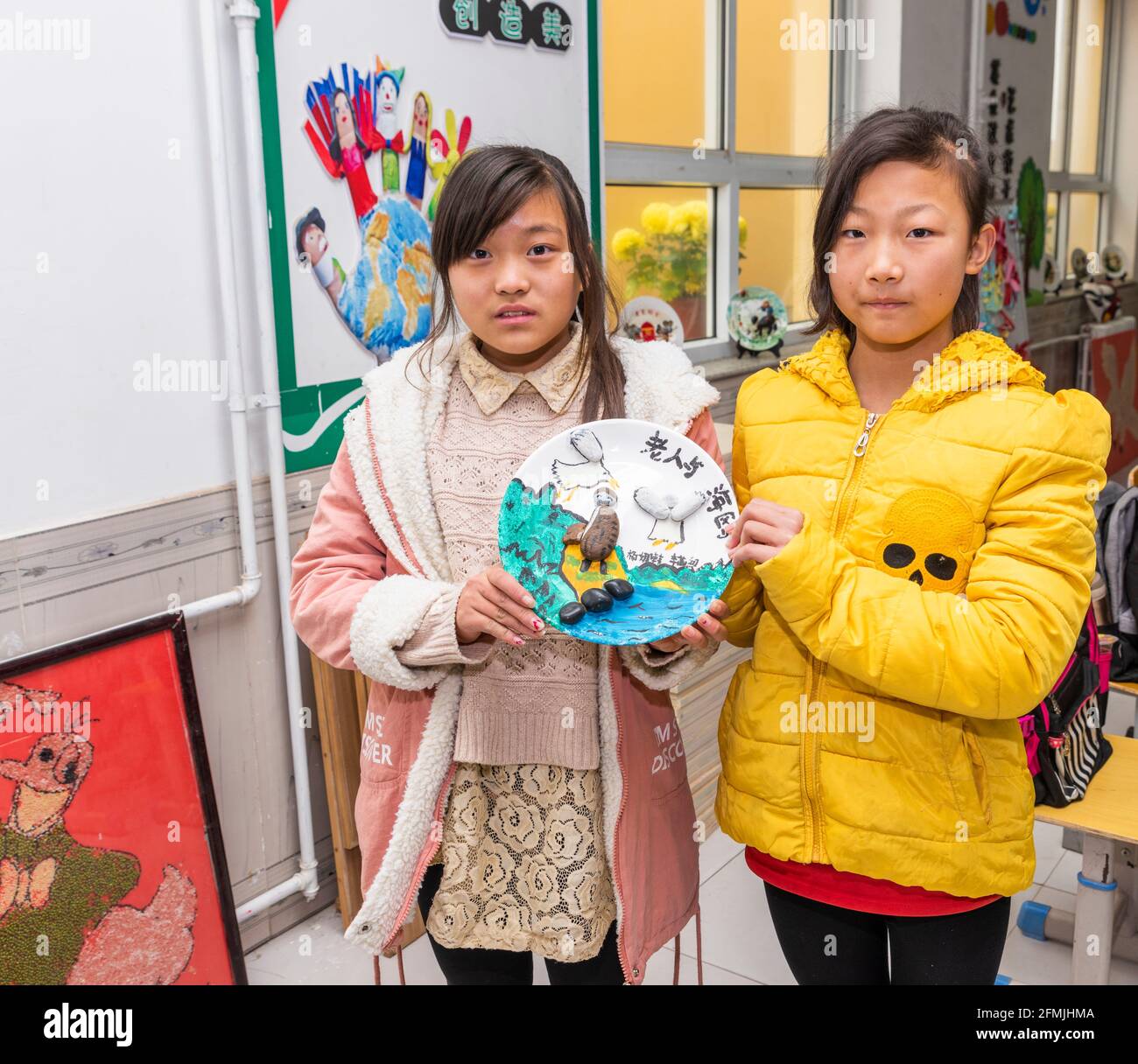 Two students show off the pottery work they created Stock Photo - Alamy