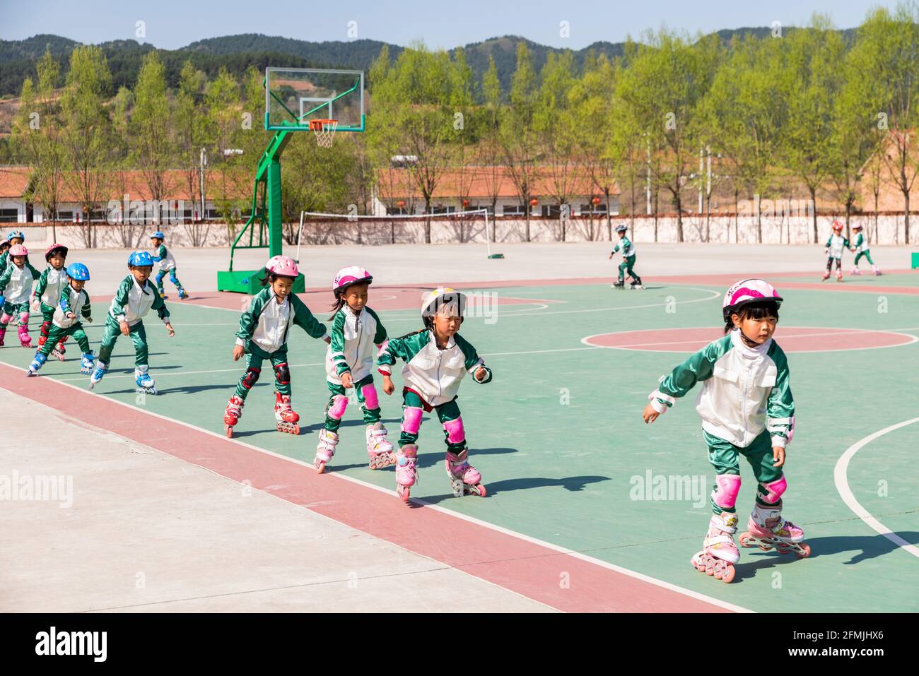 Students at BoAi school learning rollerblading. Stock Photo