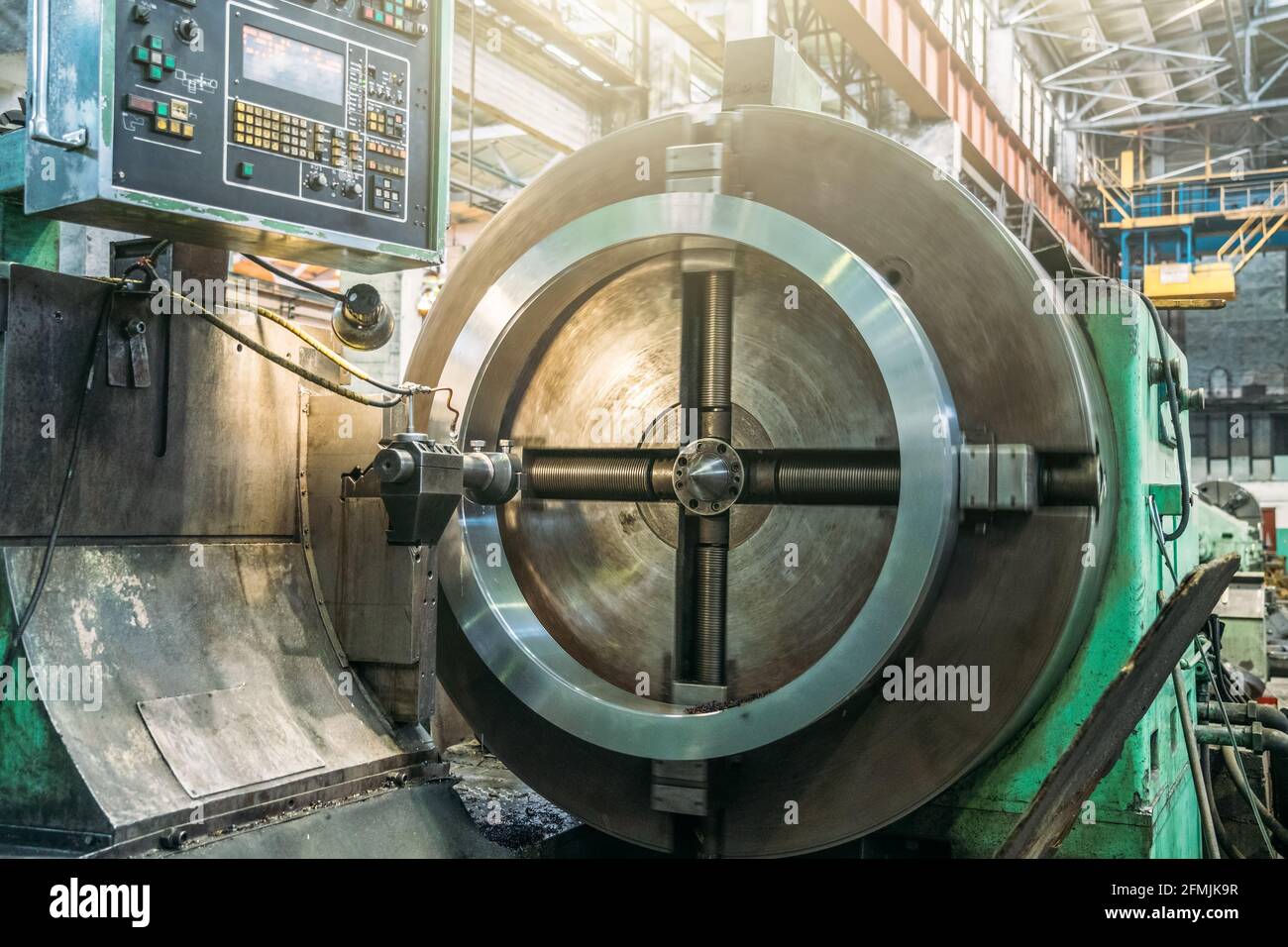 Lathe automated machine in factory boring of part with