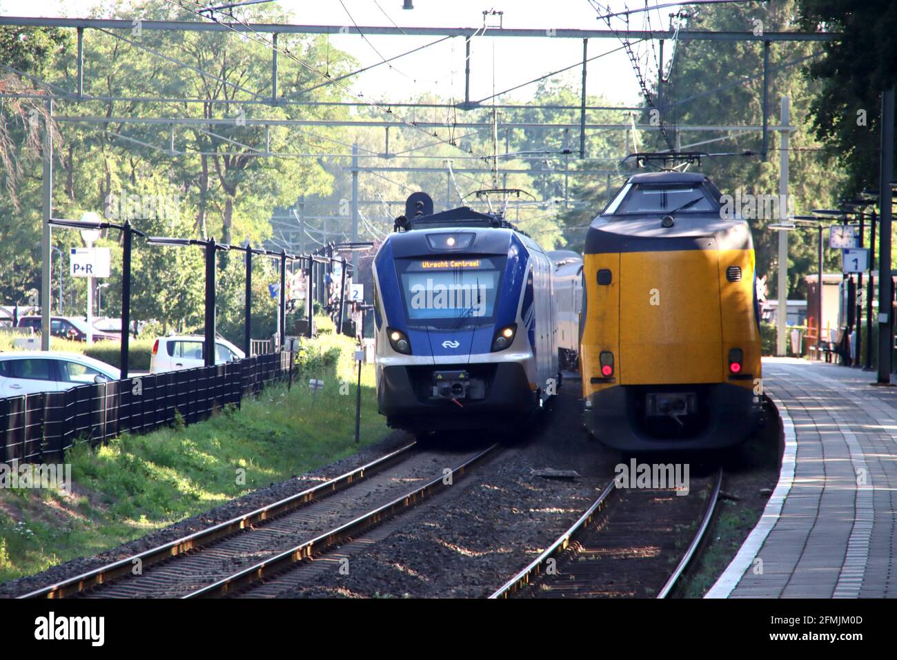 SNG sprinter and ICM koploper intercity at railroad track at Wezep in the Netherlands Stock Photo