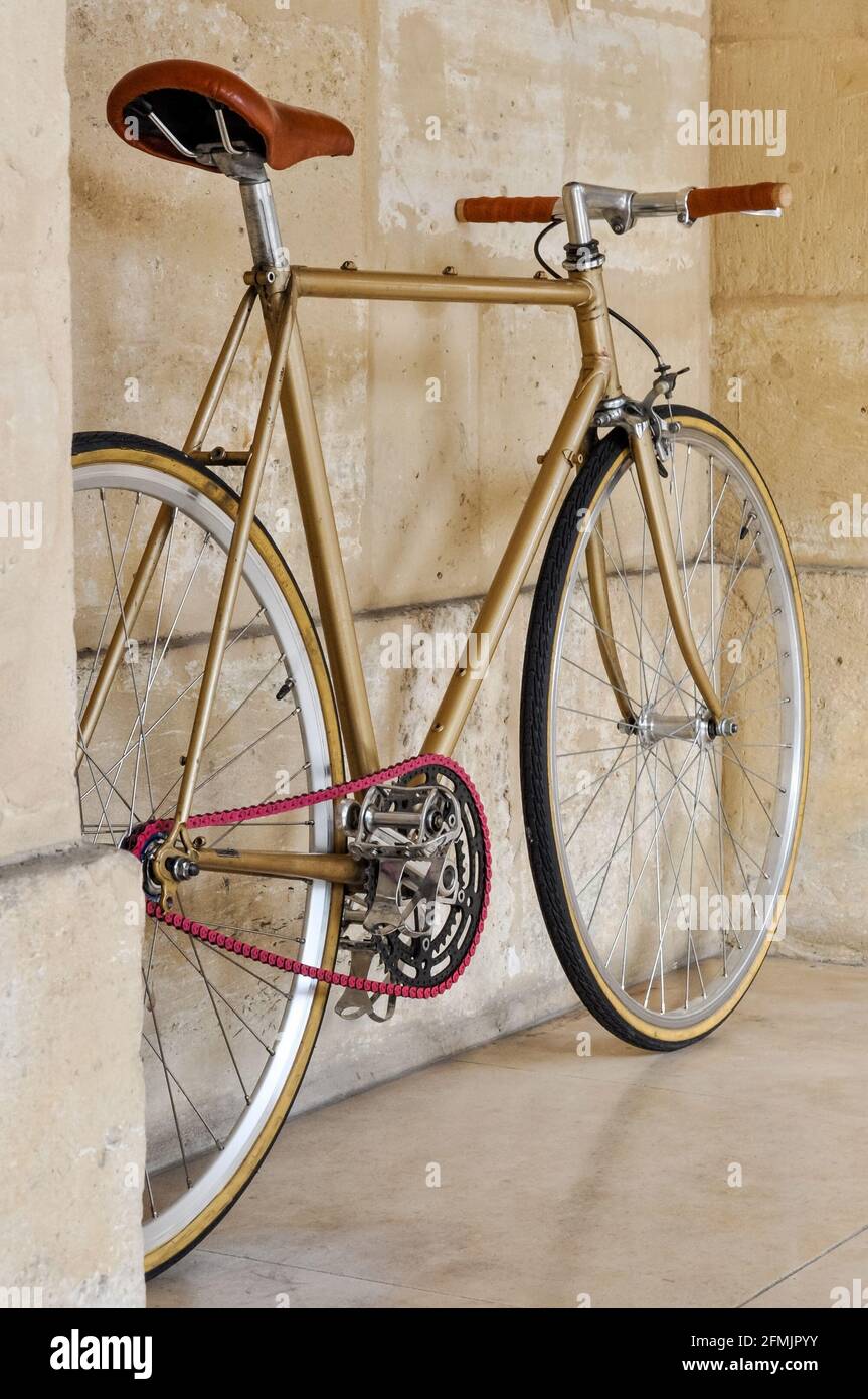 Vintage fixie bicycle with a pink chain Stock Photo