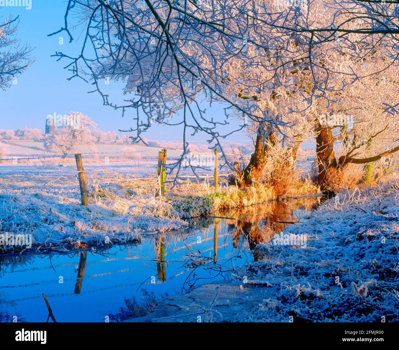 UK, England, Cheshire, Great Budworth church and river on frosted morning, Stock Photo