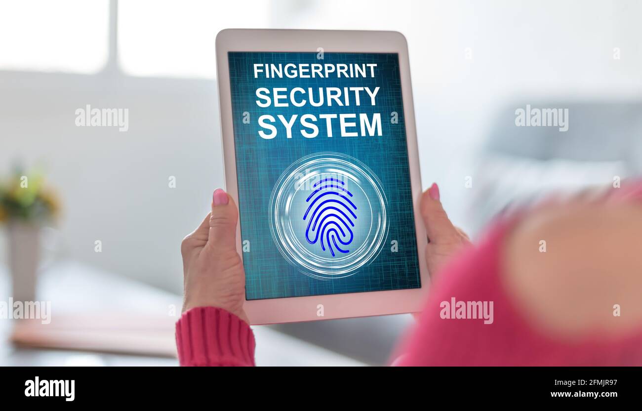Tablet screen displaying a fingerprint security system concept Stock ...