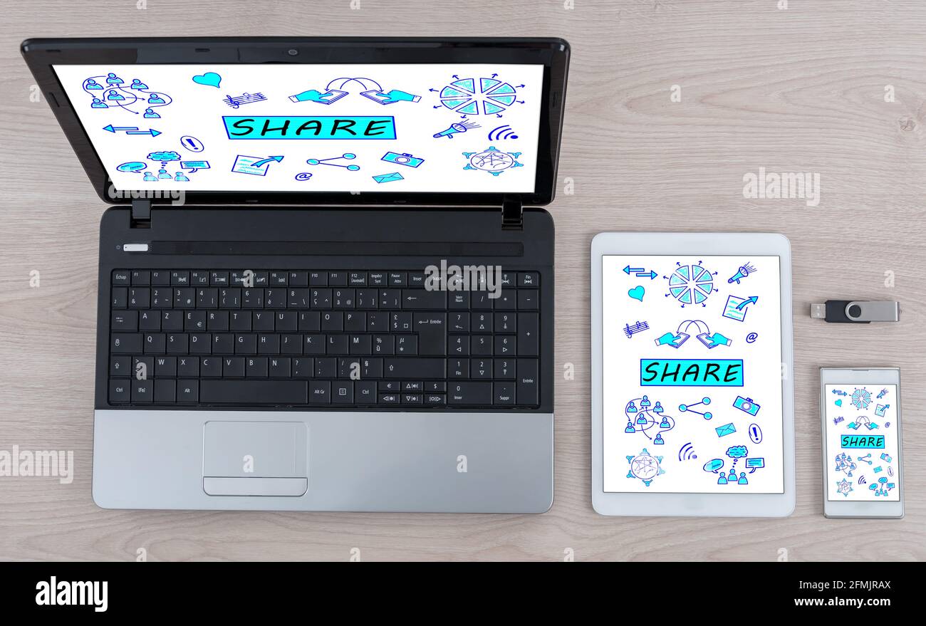 Share concept shown on different information technology devices Stock Photo
