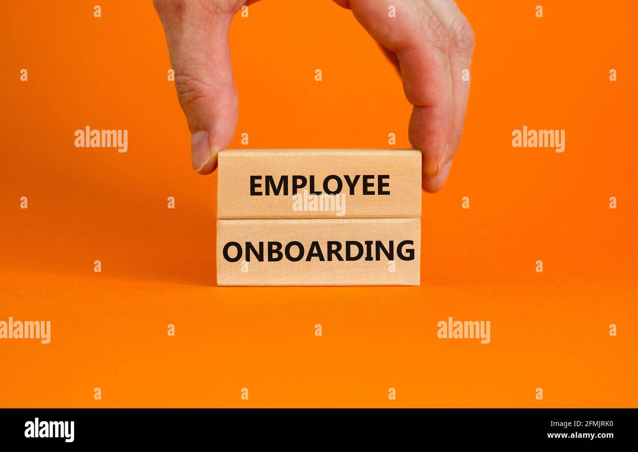 Employee onboarding success symbol. Wooden blocks with words 'Employee ...