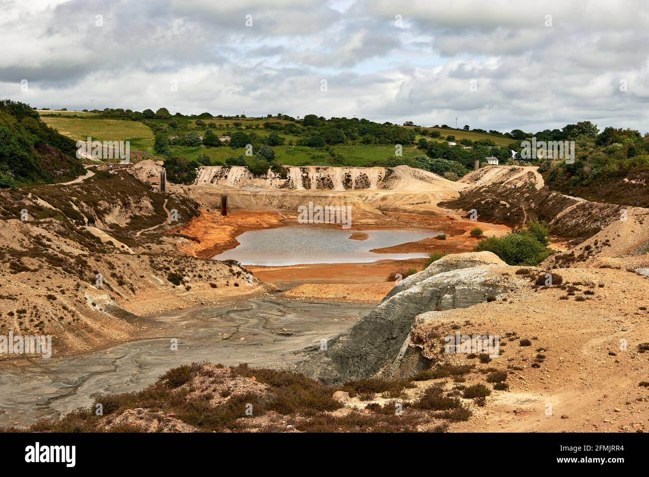 Abandoned copper mine and tailings lagoon at Wheal Maid Valley, St. Day, Cornwall, England, UK Stock Photo