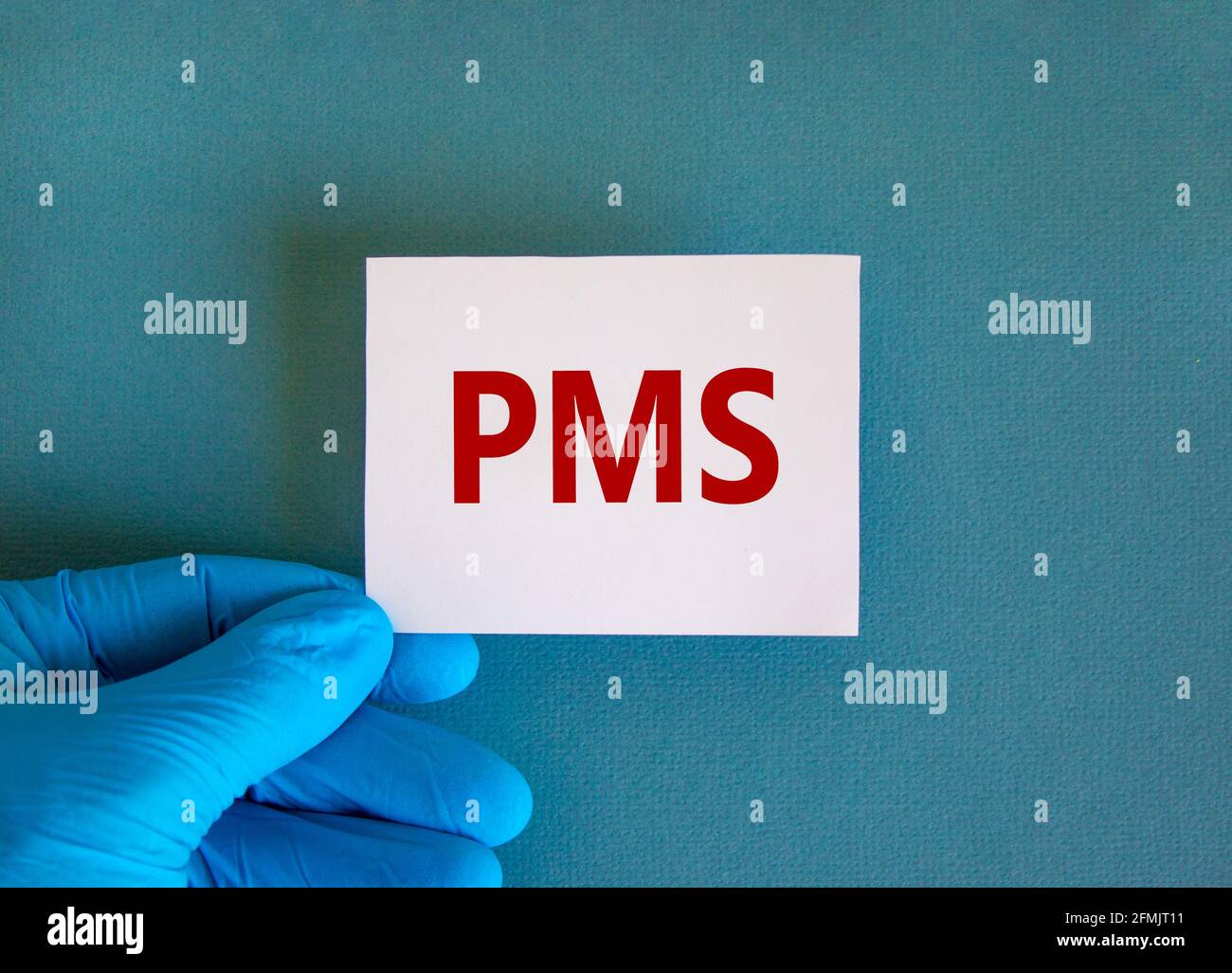 Medical and PMS, premenstrual syndrome symbol. White card with the word ...