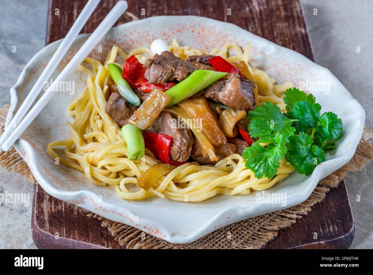 Duck stir fry with pineapple and egg noodles Stock Photo Alamy