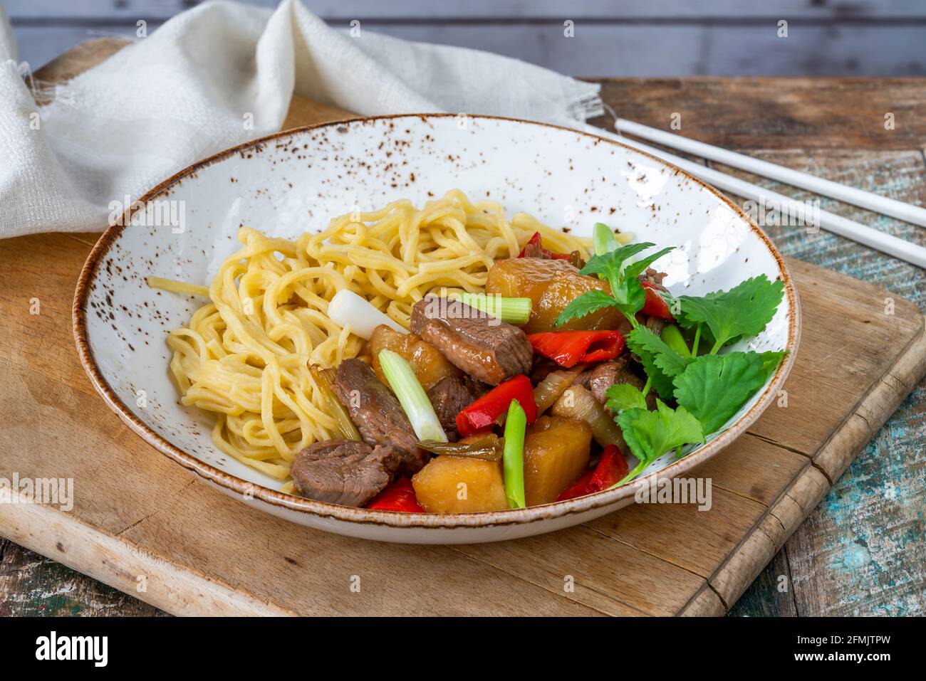Duck stir fry with pineapple and egg noodles Stock Photo Alamy