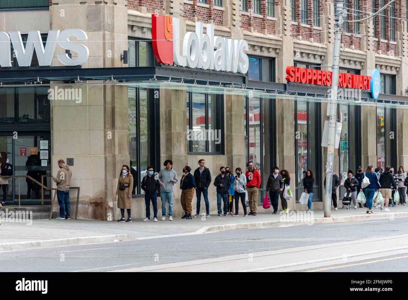 People lining up to get the Covid19 vaccine on a Shoppers Drug Mart in
