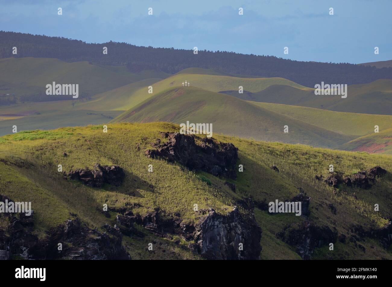 Three little white crosses on the top of the hill seen from Rano Kau volcano at Easter Island Stock Photo