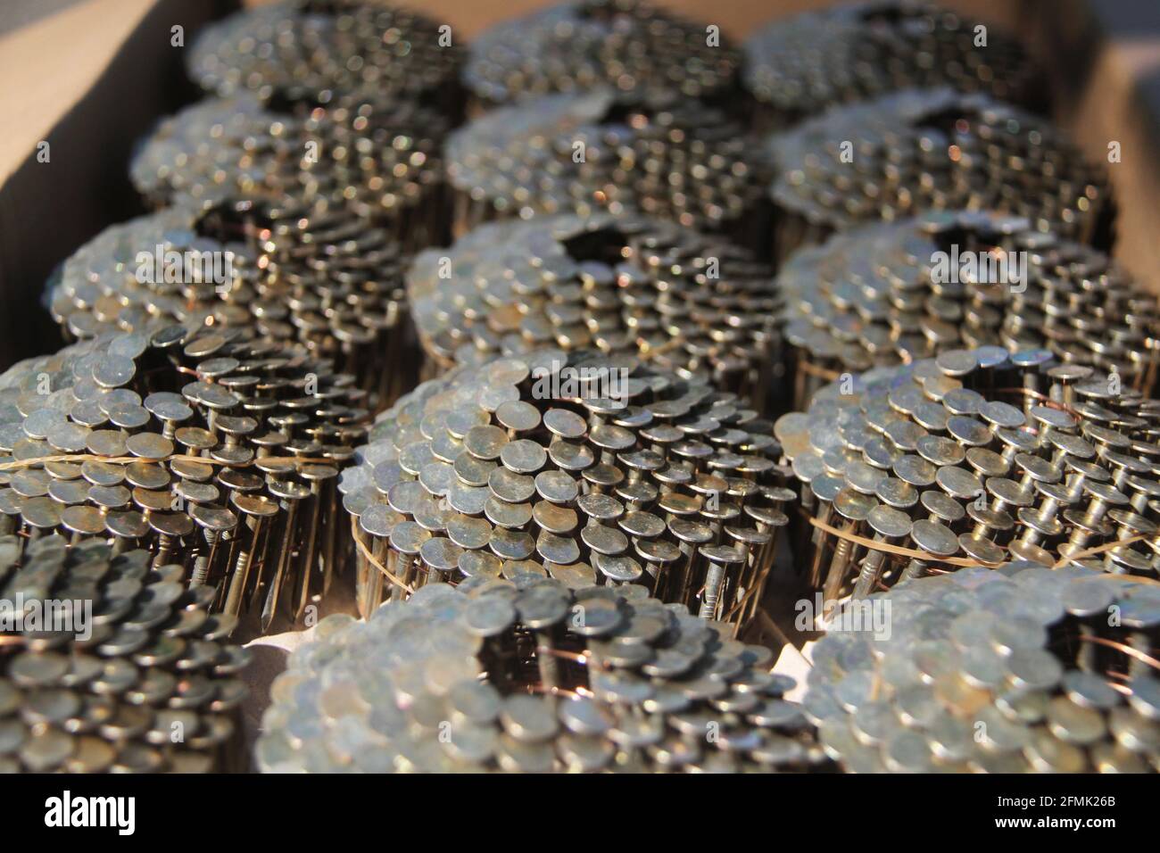 Stainless steel roofing coil nails, wire collated Stock Photo Alamy