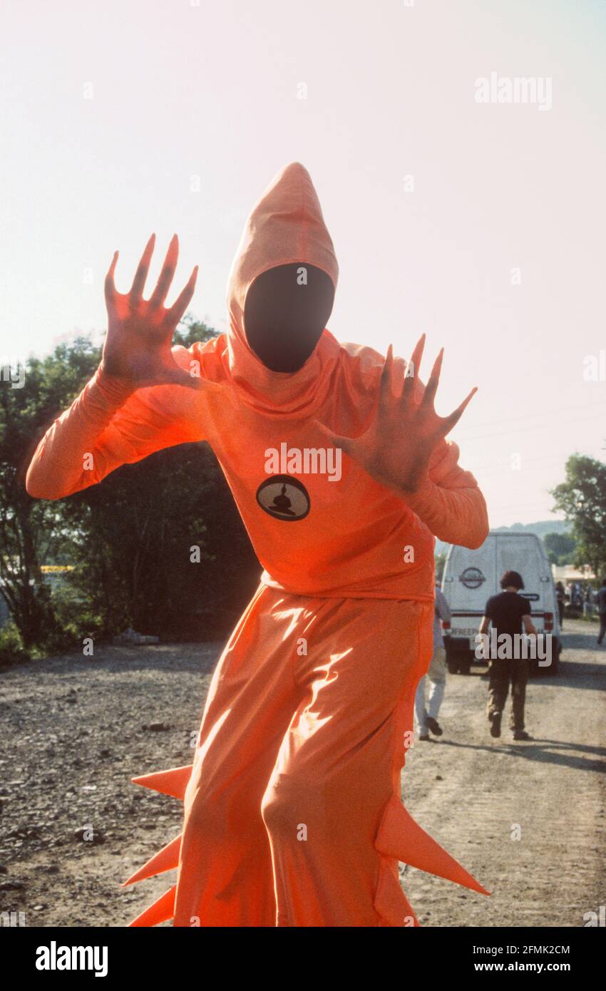 Fancy dress stilt walkers at the Glastonbury Festival 1999, Somerset, England, United Kingdom