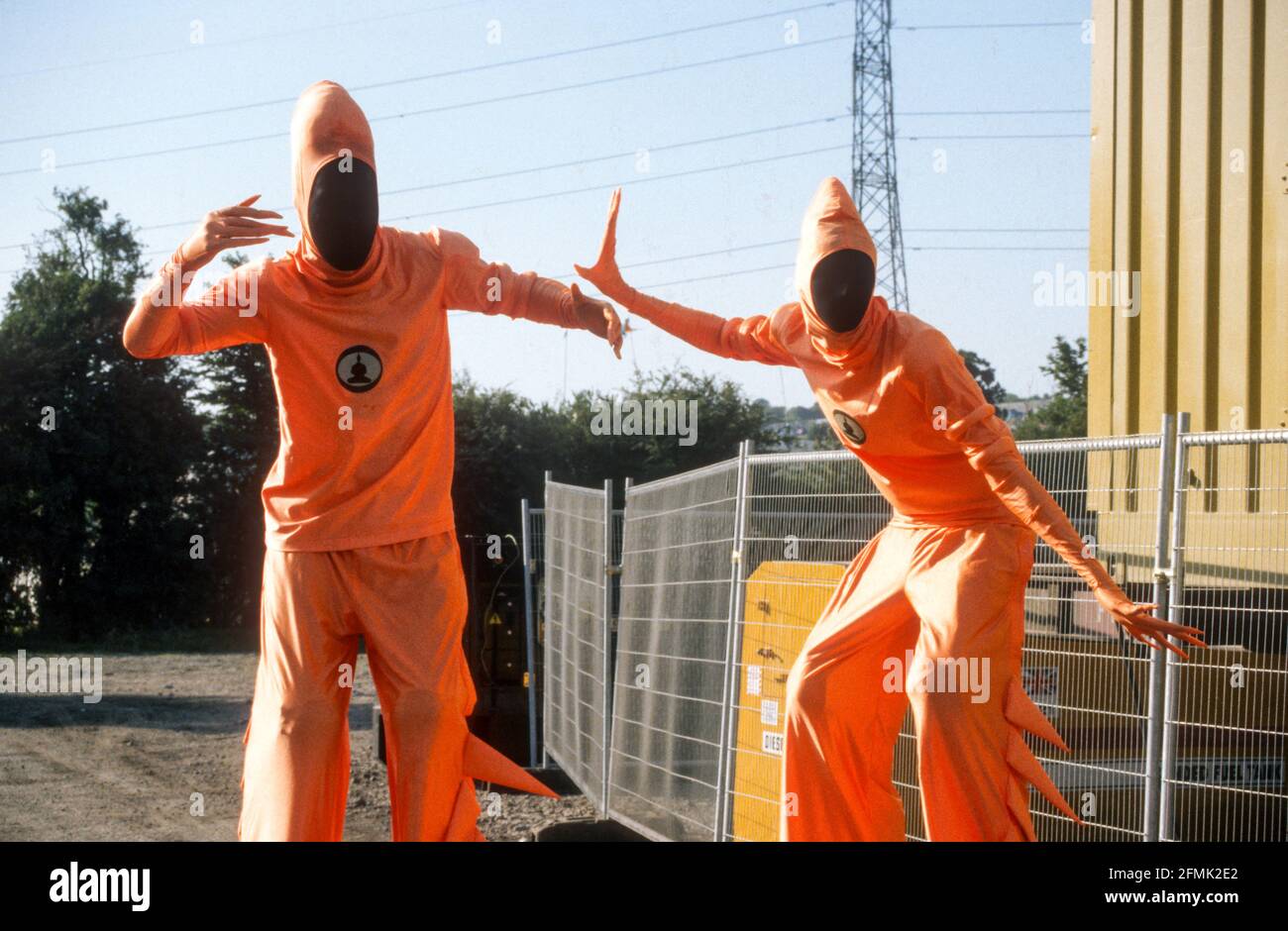 Fancy dress stilt walkers at the Glastonbury Festival 1999, Somerset, England, United Kingdom