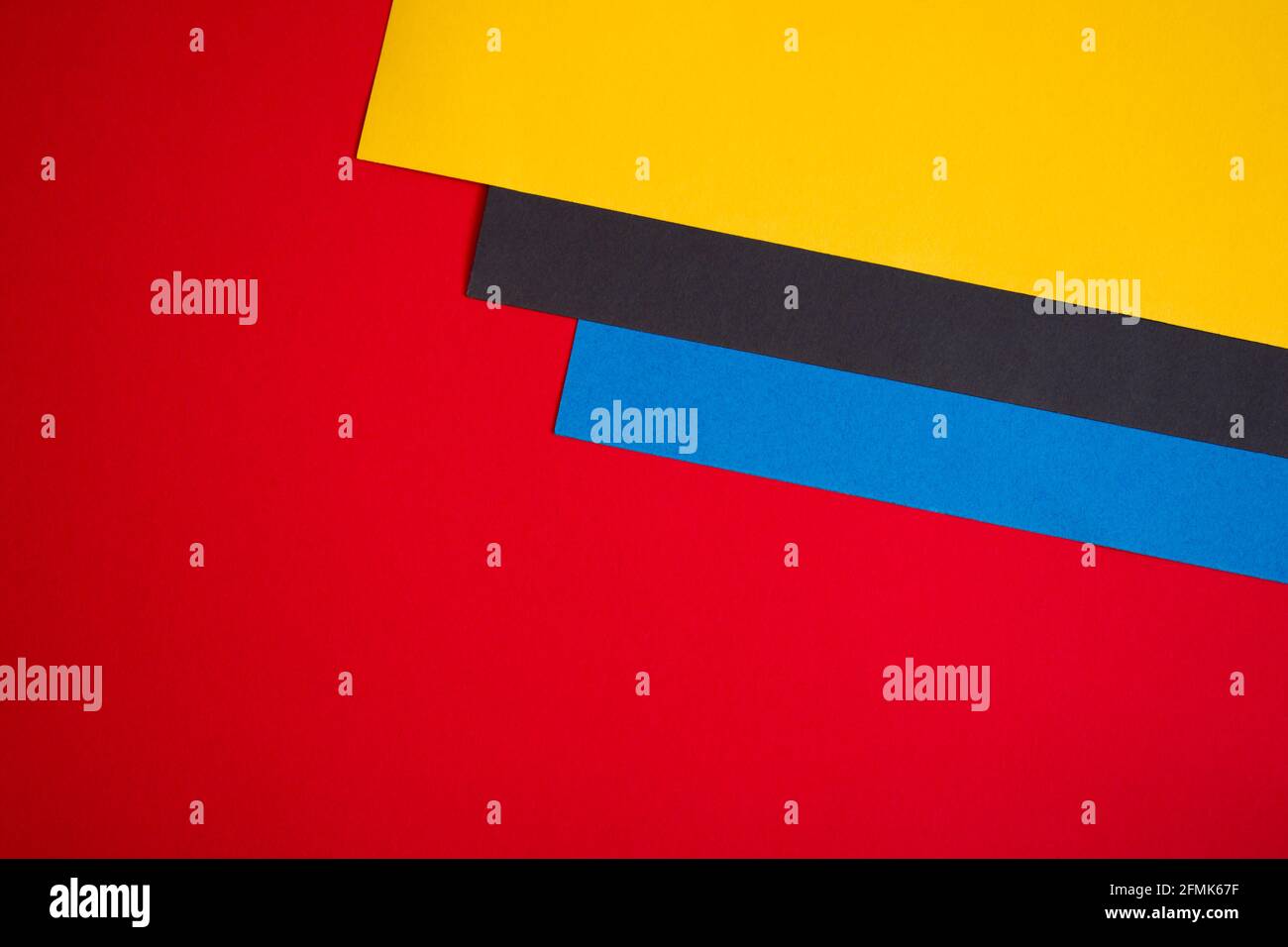 Red, yellow, black and blue colored paper background Stock Photo Alamy