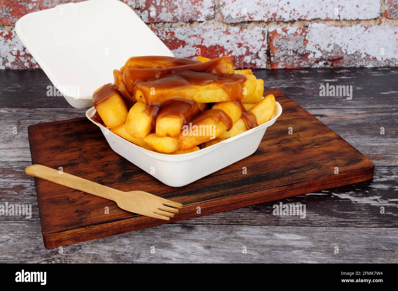 Chips and gravy meal in a take away box with lid Stock Photo Alamy