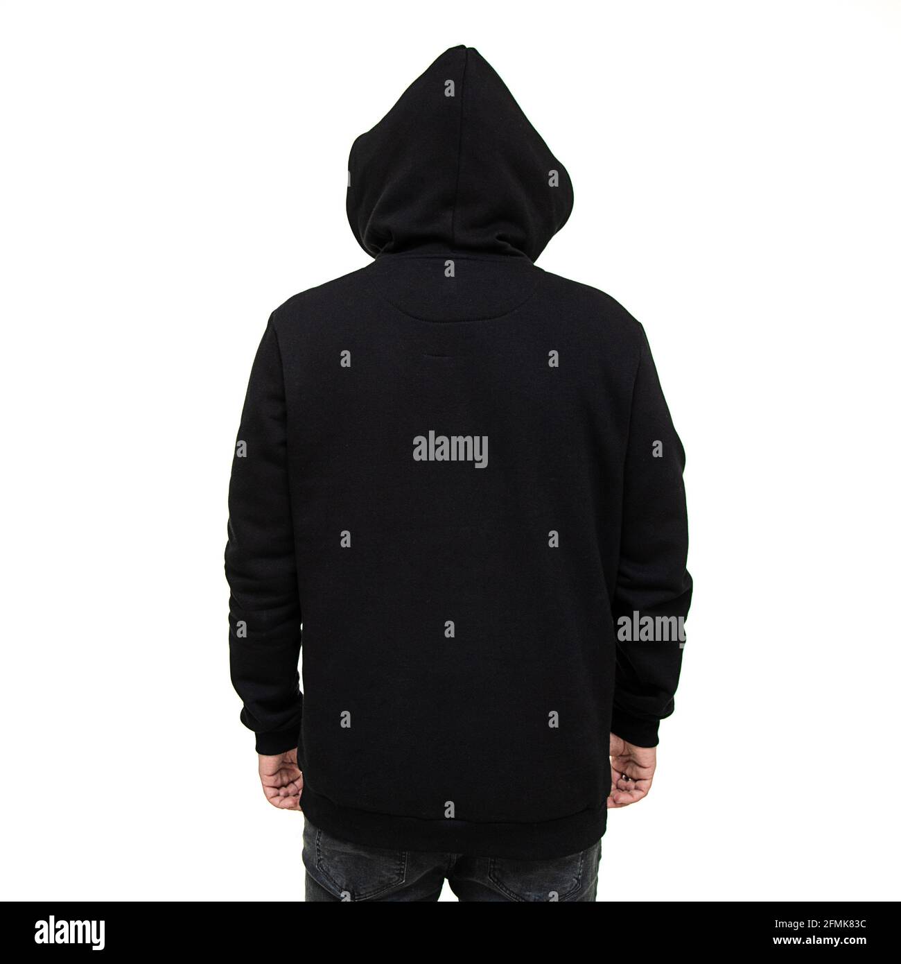 Black hoodie with a hood on a man isolated on a white background, back view. Mock up for production Stock Photo