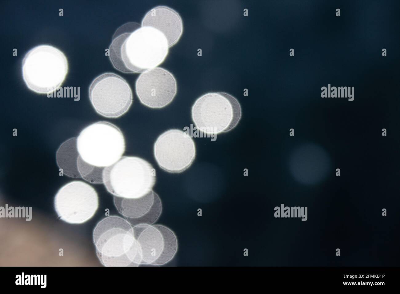 Abstract bokeh light in water.World Water Day Sea surface blink bokeh Stock Photo