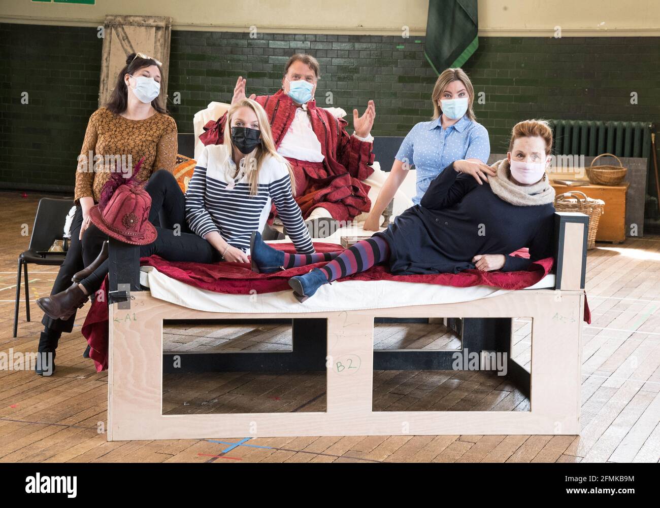 (Left to Right) Sara Fulgoni, Chloe Morgan, Bryn Terfel, Natalya Romaniw and Janis Kelly, masked and socially distanced during a rehearsal of Falstaff for the Grange Park Opera. The rehearsals have been taking part at Alford House, in London, before the opera is seen from the 10th June-18 July. Picture date: Monday May 10, 2021. Stock Photo