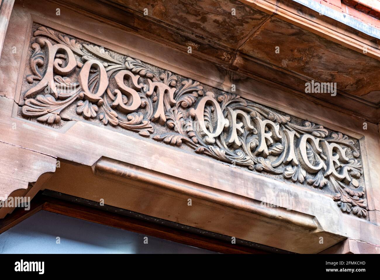 Carved Post Office sign above entrance in Congleton Cheshire UK Stock Photo